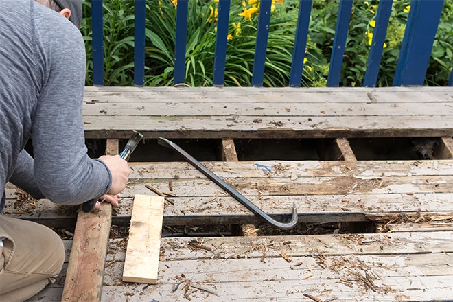 Deck Maintenance Tips For Deck Owners In Belvidere, IL 7 Deck maintenance tip in action-repairing and replacing deck boards
