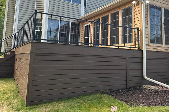 Black metal railing that meets the deck railing height code in Illinois - Hard Decks Black metal railing that meets the deck railing height code in Illinois