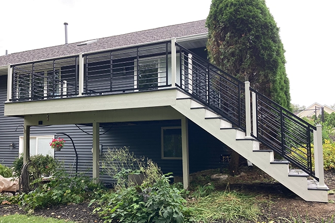 Outdoor Style Starts at the Edge: Creative Deck Railing Inspiration 1 Horizontal deck railing ideas include black metal