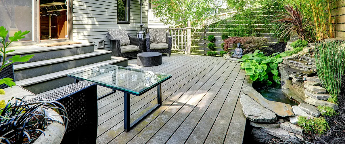 Deck Building in Roscoe, IL 8 Cozy garden deck with modern seating and small water feature