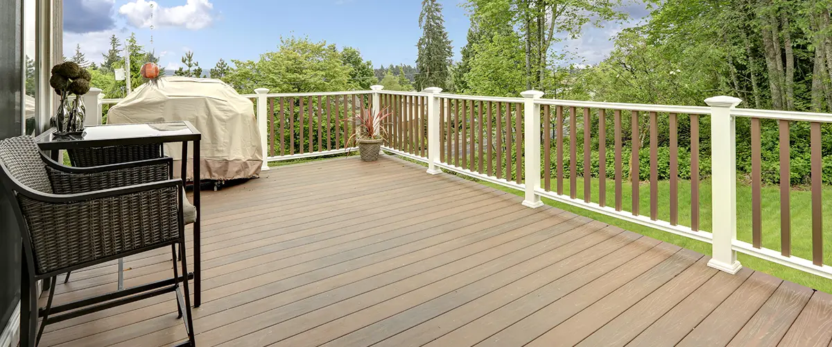 Deck Replacement in Roscoe, IL 2 Spacious deck with modern railing overlooking a green backyard