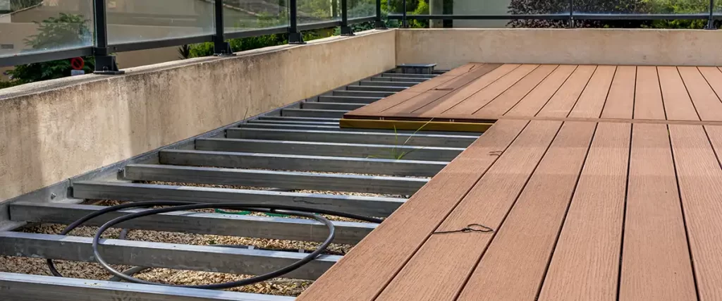 Composite decking installation over metal frame
