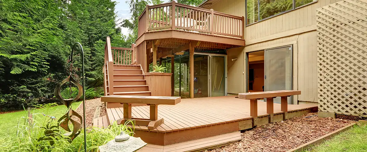 Backyard deck with upper level and built-in bench