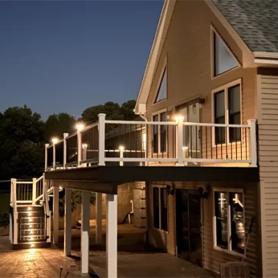 large deck lit up by lights at night large deck lit up by lights at night